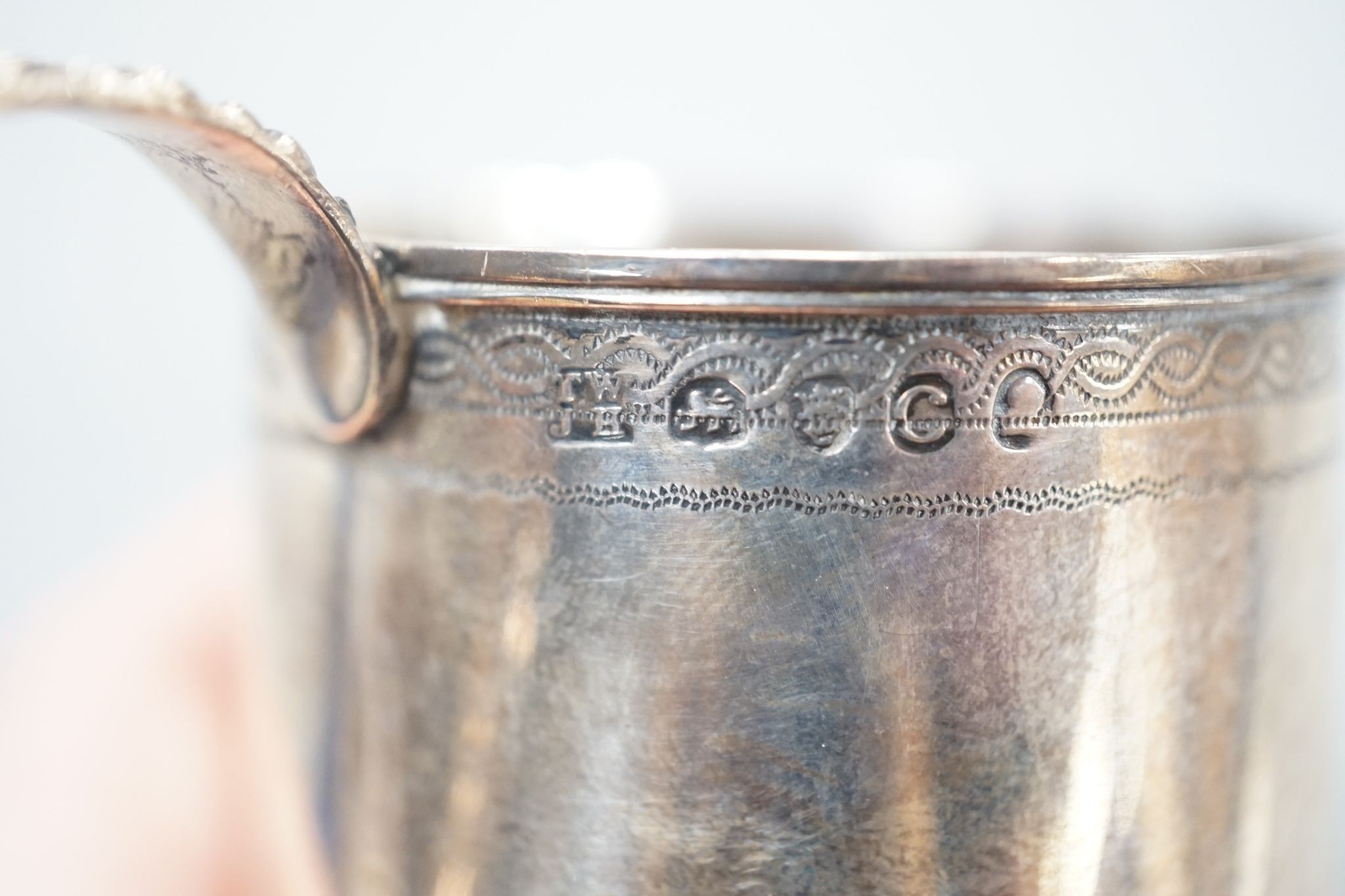 A George III silver small mug, Thomas Wallis & Jonthan Hayne, London, 1818, with engraved monogram, 57mm, 60 grams.